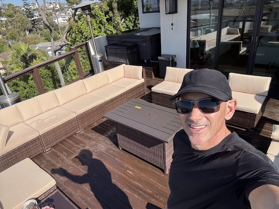 Glenn Hemanes on a deck after organizing the outdoor seating.